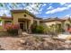 Inviting home with beautiful desert landscaping, a tile roof, and a decorative entrance at 42102 N Long Cove Way, Phoenix, AZ 85086
