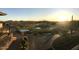 Lush golf course views with serene ponds as the sun rises in the background at 42102 N Long Cove Way, Phoenix, AZ 85086