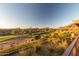 Picturesque golf course view showcasing the desert landscape with mature vegetation at 42102 N Long Cove Way, Phoenix, AZ 85086