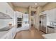 Well-equipped kitchen features modern appliances, white cabinetry, and ample counter space at 42102 N Long Cove Way, Phoenix, AZ 85086