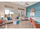 Bright living space features comfortable seating, large windows, and an open floor plan at 42102 N Long Cove Way, Phoenix, AZ 85086
