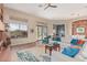 Comfortable living room with backyard views, cozy seating, and stylish decor throughout at 42102 N Long Cove Way, Phoenix, AZ 85086