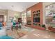 Cozy living room with a fireplace, built-in shelving, and an inviting seating area at 42102 N Long Cove Way, Phoenix, AZ 85086