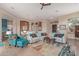 Bright living room boasts a large sectional sofa, colorful accents, and ample natural light at 42102 N Long Cove Way, Phoenix, AZ 85086