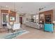Open concept living room with dining area, fireplace, and ample natural light at 42102 N Long Cove Way, Phoenix, AZ 85086