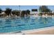 Community pool with lane markers and various seating options at 42102 N Long Cove Way, Phoenix, AZ 85086