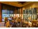 Inviting restaurant with well-appointed tables and a beautiful view of the desert landscape at 42102 N Long Cove Way, Phoenix, AZ 85086