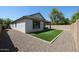 Spacious backyard with low-maintenance landscaping and a covered patio at 4336 E Mesquite St, Gilbert, AZ 85296