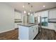 Beautiful kitchen with stainless steel appliances, a center island, and white cabinets at 4336 E Mesquite St, Gilbert, AZ 85296