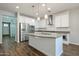 Bright kitchen featuring stainless steel appliances, a kitchen island, and ample cabinet space at 4336 E Mesquite St, Gilbert, AZ 85296