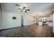 Open-concept living area features wood-style flooring and a bright, airy atmosphere at 4336 E Mesquite St, Gilbert, AZ 85296