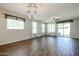 Large living room with wood-style flooring, recessed lighting, and plenty of natural light at 4336 E Mesquite St, Gilbert, AZ 85296