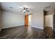 Bedroom features a stylish sliding barn door, accent wall and wood-look tile floors at 4336 E Mesquite St, Gilbert, AZ 85296