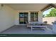 Covered patio with outdoor dining area and sliding glass doors at 4336 E Mesquite St, Gilbert, AZ 85296