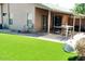 Enjoy the outdoors with a well maintained backyard with artificial grass and a covered patio at 43914 W Wade Dr, Maricopa, AZ 85138