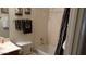 Bathroom with a tub and shower combo, toilet, and towel rack at 43914 W Wade Dr, Maricopa, AZ 85138