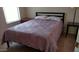 Bedroom with a bed, side tables, and carpeted floor at 43914 W Wade Dr, Maricopa, AZ 85138