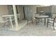 Covered patio with an assortment of outdoor furniture on pavers at 43914 W Wade Dr, Maricopa, AZ 85138