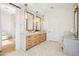 Bright bathroom with double vanities, stylish mirrors, and a separate vanity area at 4502 E Solano Dr, Phoenix, AZ 85018