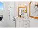 Bright bathroom with a glass enclosed shower, single sink vanity, and sleek fixtures at 4502 E Solano Dr, Phoenix, AZ 85018