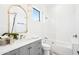 Stylish bathroom features a marble countertop vanity, gold fixtures, and a glass-enclosed shower for a spa-like experience at 4502 E Solano Dr, Phoenix, AZ 85018