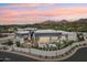 Stunning home with modern architecture, desert landscaping, a private courtyard, and a gated driveway at sunset at 4502 E Solano Dr, Phoenix, AZ 85018