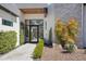 Stunning front entrance featuring a modern design, desert landscaping, and a welcoming walkway at 4502 E Solano Dr, Phoenix, AZ 85018