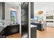 An expansive kitchen with white countertops, stainless appliances, and seamless connection to the dining area at 4502 E Solano Dr, Phoenix, AZ 85018