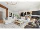 Bright living room featuring modern furniture, hardwood floors, and an open concept design, perfect for entertaining at 4502 E Solano Dr, Phoenix, AZ 85018