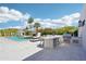 Outdoor kitchen with built-in grill, perfect for entertaining by the pool and enjoying the beautiful desert landscape at 4502 E Solano Dr, Phoenix, AZ 85018
