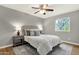 Comfortable bedroom featuring a ceiling fan, bedside tables with lamps, and a window offering natural light at 4840 E Sunnyside Dr, Scottsdale, AZ 85254