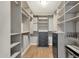 Organized walk-in closet with custom shelving and drawers, providing ample storage space at 4840 E Sunnyside Dr, Scottsdale, AZ 85254