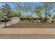 Attractive single-level house with a well-maintained front yard, desert landscaping, and an attached garage at 4840 E Sunnyside Dr, Scottsdale, AZ 85254