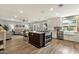 Open-concept kitchen features a center island, modern appliances, and seamless flow to the living space at 4840 E Sunnyside Dr, Scottsdale, AZ 85254