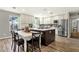 Bright kitchen with a spacious island, stainless steel appliances, modern cabinets, and adjacent dining area at 4840 E Sunnyside Dr, Scottsdale, AZ 85254