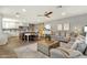 Spacious and open living area with a view of the kitchen, dining space, and a comfortable seating area with stylish décor at 4840 E Sunnyside Dr, Scottsdale, AZ 85254