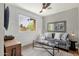 Comfortable living room with a large window, neutral decor, stylish furniture, and ample natural light at 4840 E Sunnyside Dr, Scottsdale, AZ 85254
