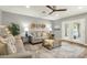Inviting living room featuring comfortable seating, modern decor, and ample natural light streaming through the glass patio doors at 4840 E Sunnyside Dr, Scottsdale, AZ 85254