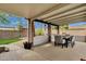 Charming covered patio with dining area and beautiful landscaping, perfect for outdoor entertaining and relaxation at 4840 E Sunnyside Dr, Scottsdale, AZ 85254