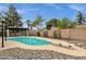 Backyard pool featuring a diving board, shaded pergola, and decorative rock landscaping at 4840 E Sunnyside Dr, Scottsdale, AZ 85254