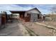 Exterior view of a home with covered patio and unfinished landscaping at 509 W 12Th St, Casa Grande, AZ 85122