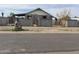 Quaint single story home featuring a gated front yard and stone accents in a residential area at 509 W 12Th St, Casa Grande, AZ 85122