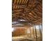 View of the home's interior featuring wood beams and stud framing at 509 W 12Th St, Casa Grande, AZ 85122