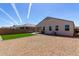 A backyard featuring low maintenance landscaping and an artificial lawn at 5146 E Diatomite Dr, San Tan Valley, AZ 85143