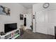 The carpeted bedroom has a closet with white doors, a TV on a stand, and a neutral color palette for a calming retreat at 5146 E Diatomite Dr, San Tan Valley, AZ 85143