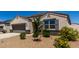 Front exterior of home displaying desert landscaping, stone accents, and manicured curb appeal at 5146 E Diatomite Dr, San Tan Valley, AZ 85143
