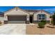 Charming single-story home with a two-car garage, desert landscaping, and a cozy front entrance at 5146 E Diatomite Dr, San Tan Valley, AZ 85143