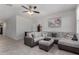 Spacious living room with neutral tones, a ceiling fan, and stylish decor at 5146 E Diatomite Dr, San Tan Valley, AZ 85143