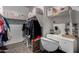 Walk-in closet with custom shelving and a built-in vanity area at 5146 E Diatomite Dr, San Tan Valley, AZ 85143