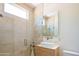 Bright bathroom with a glass shower, modern vanity, and neutral color palette at 5434 E Lincoln Dr # 58, Paradise Valley, AZ 85253